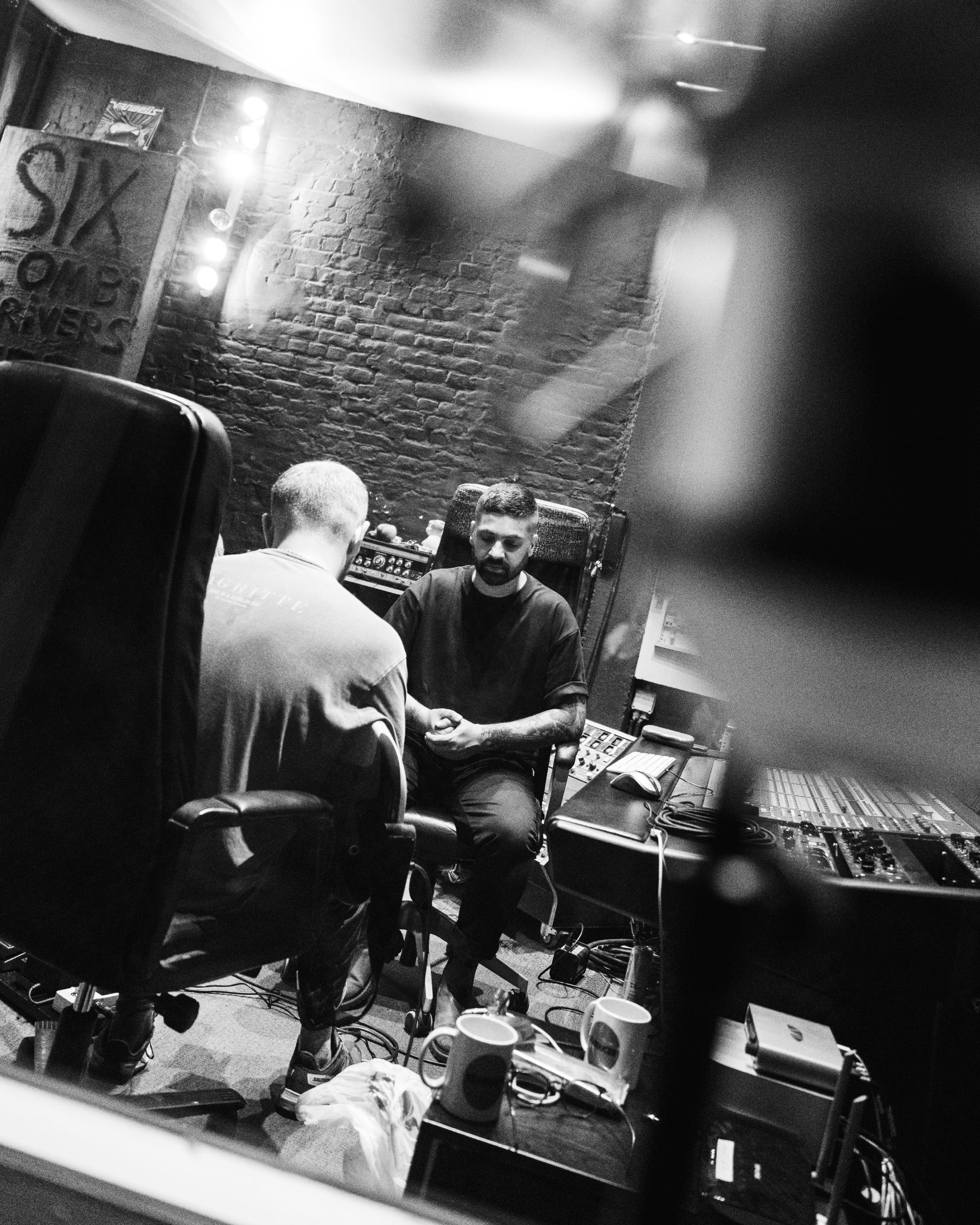 Imran Siddiqi in conversation with an artist through the control-room glass